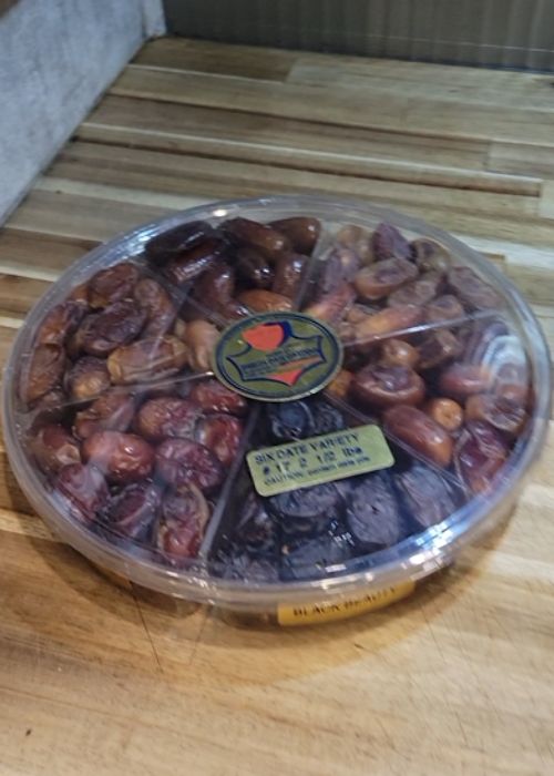 round clear plastic container or assorted fresh dates