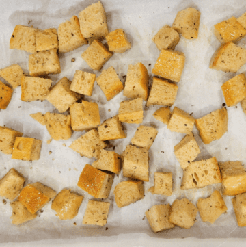 A baking sheet with cubed italian bread to make easy croutons from fresh milled flour