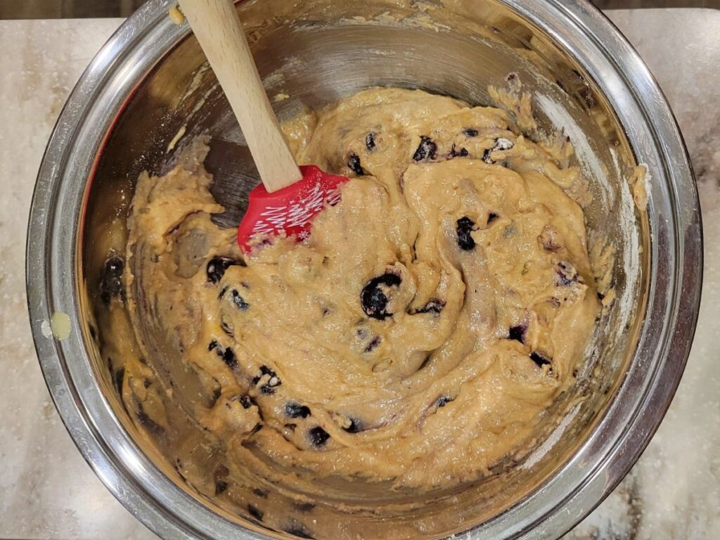 blueberry bread batter in a metal mixing bowl