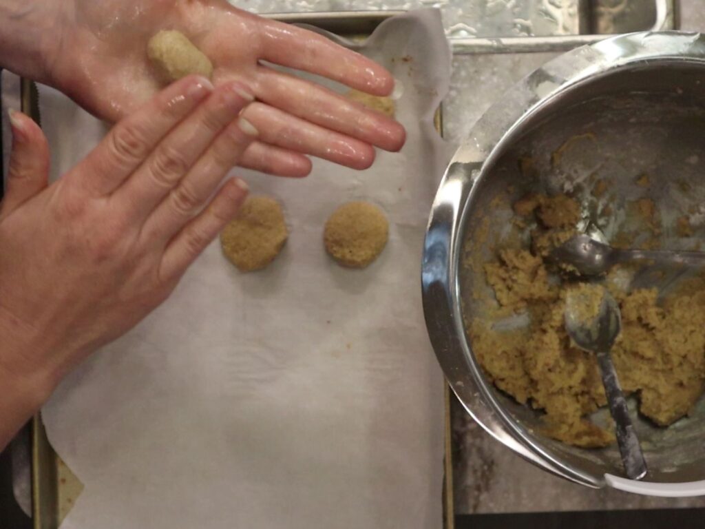 hands Rolling vanilla wafer dough balls