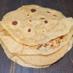 a tack of soft and foldable tortillas made with fresh milled flour