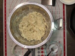 a metal bowl of fresh milled flour biscuits dough after mixing, before the rest