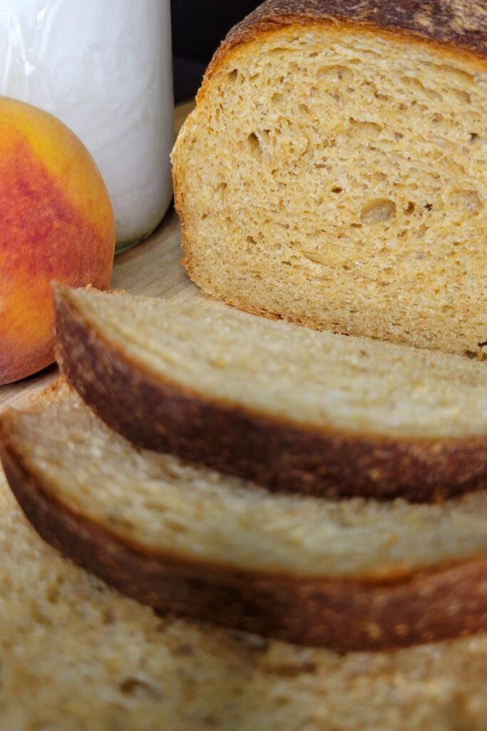 a close up of sliced peaches and cream bread made from fresh milled flour