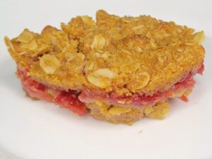 Fresh milled flour Raspberry crumble bar square on a white plate