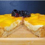 Peach Blackberry Tart made with homemade pastry cream, fresh fruit, and a fresh milled flour tart crust with a slice taken out