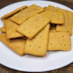 a pile of Butter Crackers made with fresh milled flour on a white plate