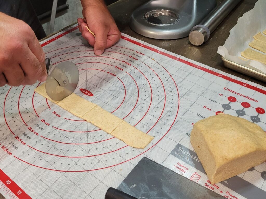 cutting the dough into 1.5 x 3 inch rectangles