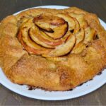 a whole homemade Apple Galette made with Fresh Milled Flour sitting on a plate