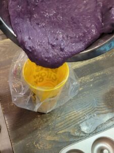 pouring batter into a piping bag