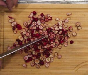 Knife rough chopping cranberries