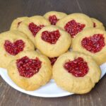 Shortbread thumbprint cookies made with fresh milled flour and small batch raspberry jam
