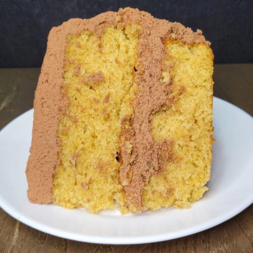 fresh milled flour yellow birthday cake slice with chocolate ganache buttercream