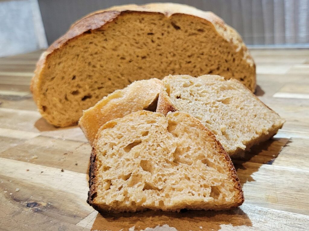 sourdough bread made with fresh milled flour sliced showing the inside crumb