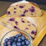 Blueberry Sourdough Bread Boule sliced with fresh blueberries