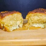 cheesy garlic pull apart bread made with fresh milled flour pulled apart showing the cheese and garlic butter filling
