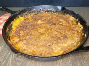 My Grandma's peach cobbler made with fresh milled flour in a cast iron skillet