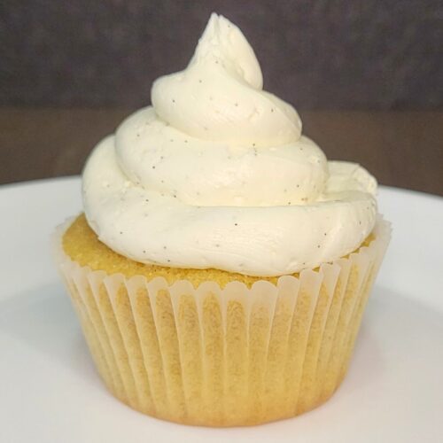 a vanilla cupcake made with fresh milled flour and topped with vanilla bean frosting