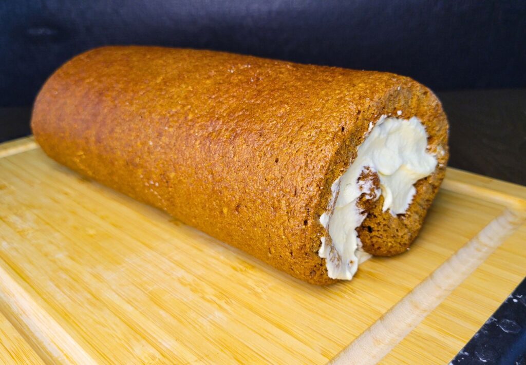 a whole pumpkin roll made with fresh milled flour and filled with cream cheese filling