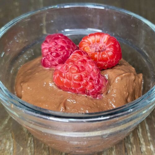 chocolate pudding made with fresh milled flour and topped with fresh raspberries