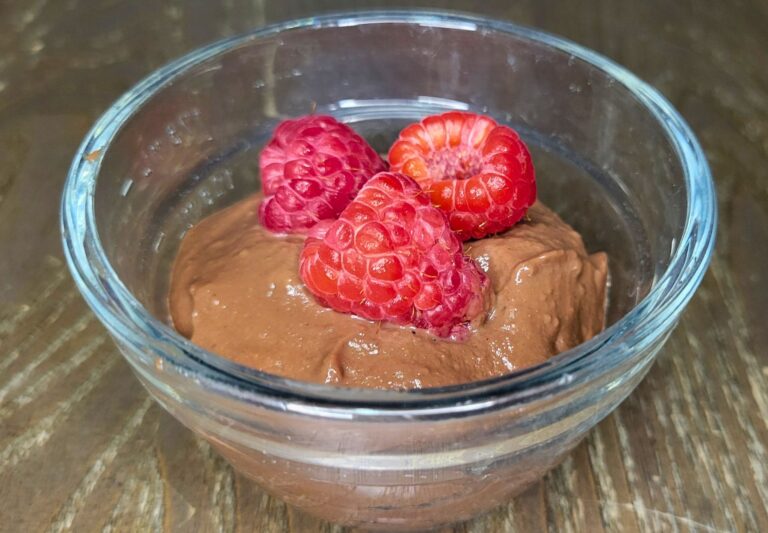 chocolate pudding made with fresh milled flour and topped with fresh raspberries