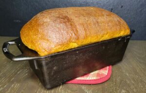 maple sandwich bread made with fresh milled flour in a cast iron loaf pan