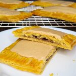 Fresh milled flour pop tarts cut in half showing the brown sugar cinnamon filling