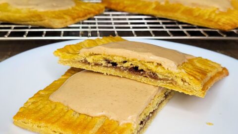 Fresh milled flour pop tarts cut in half showing the brown sugar cinnamon filling