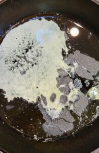 melted butter in a cast iron skillet