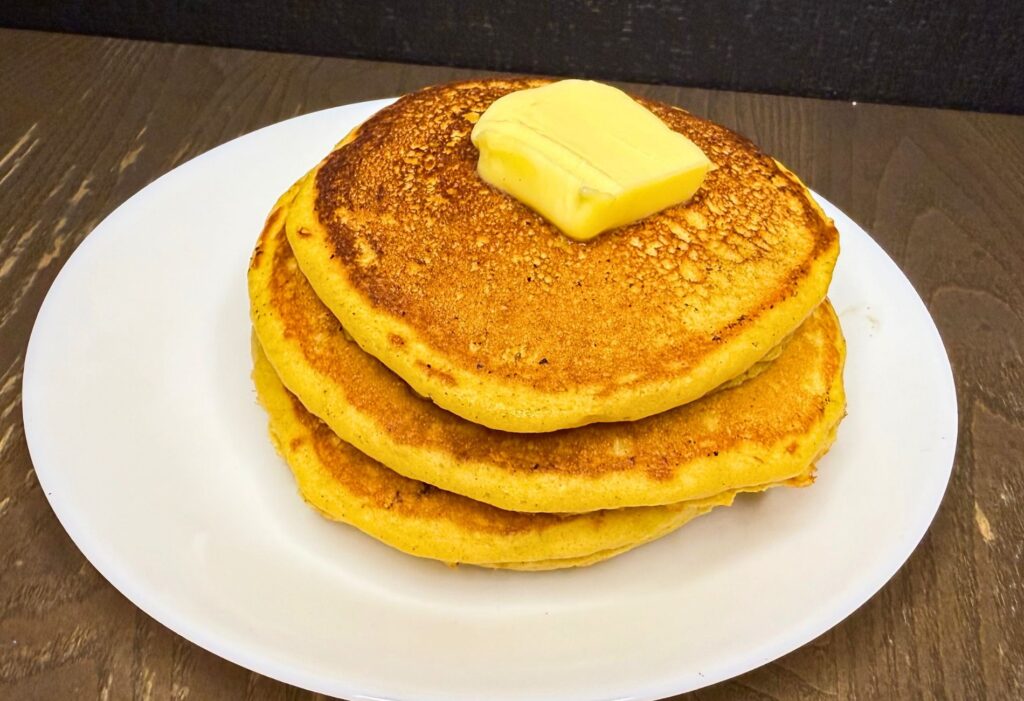Fresh milled flour pumpkin pancake stack with butter on top