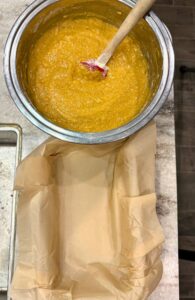 batter and parchment paper lined pan