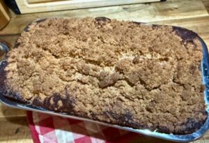 crumble topping on a fresh milled flour apple cider bread in the pan