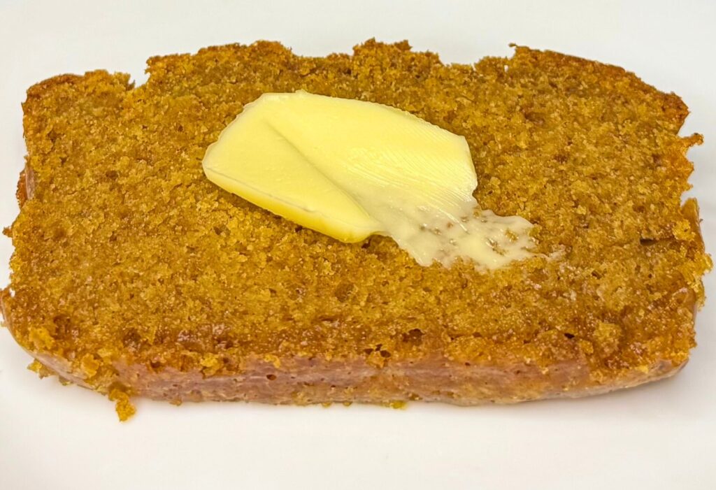 fresh milled flour pumpkin bread slice with butter