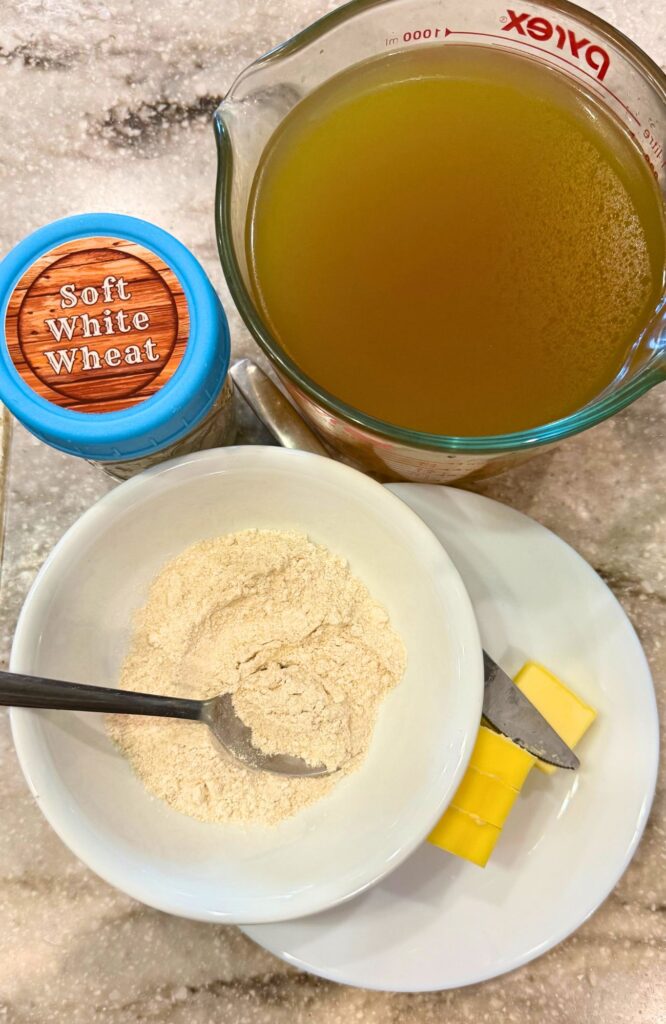 ingredients on the counter like soft white wheat butter and broth