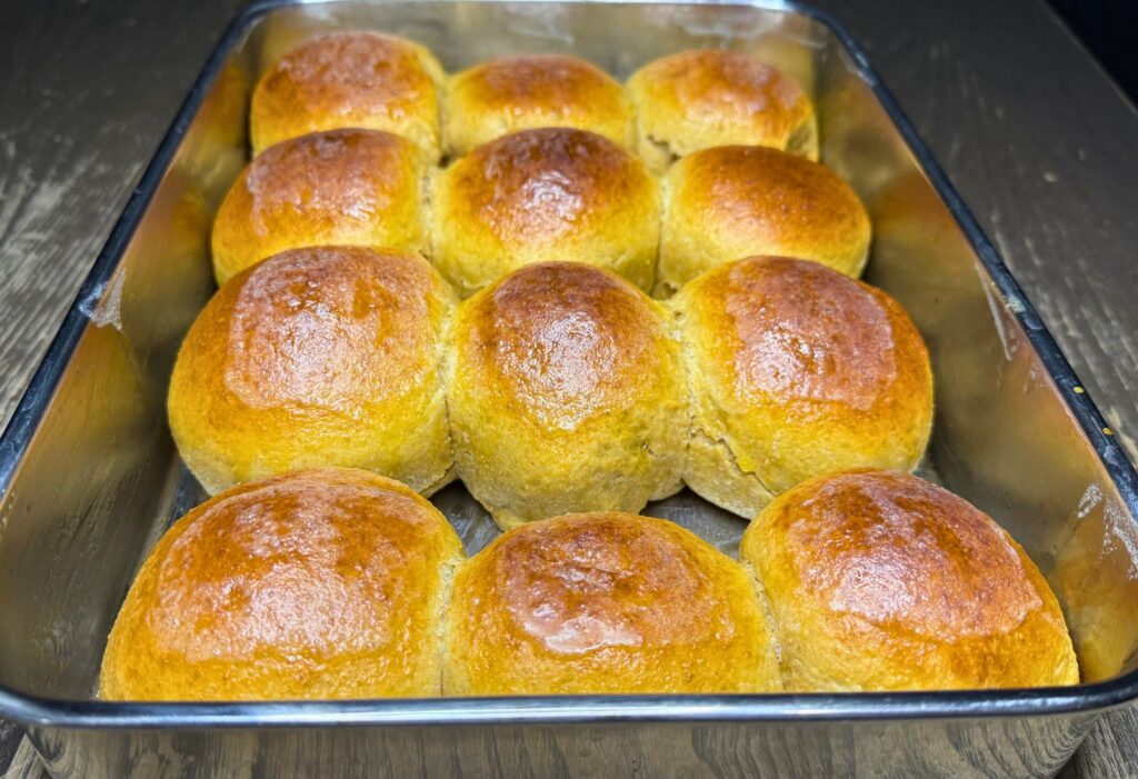 pan of baked fresh milled flour rolls with the Tangzhong method
